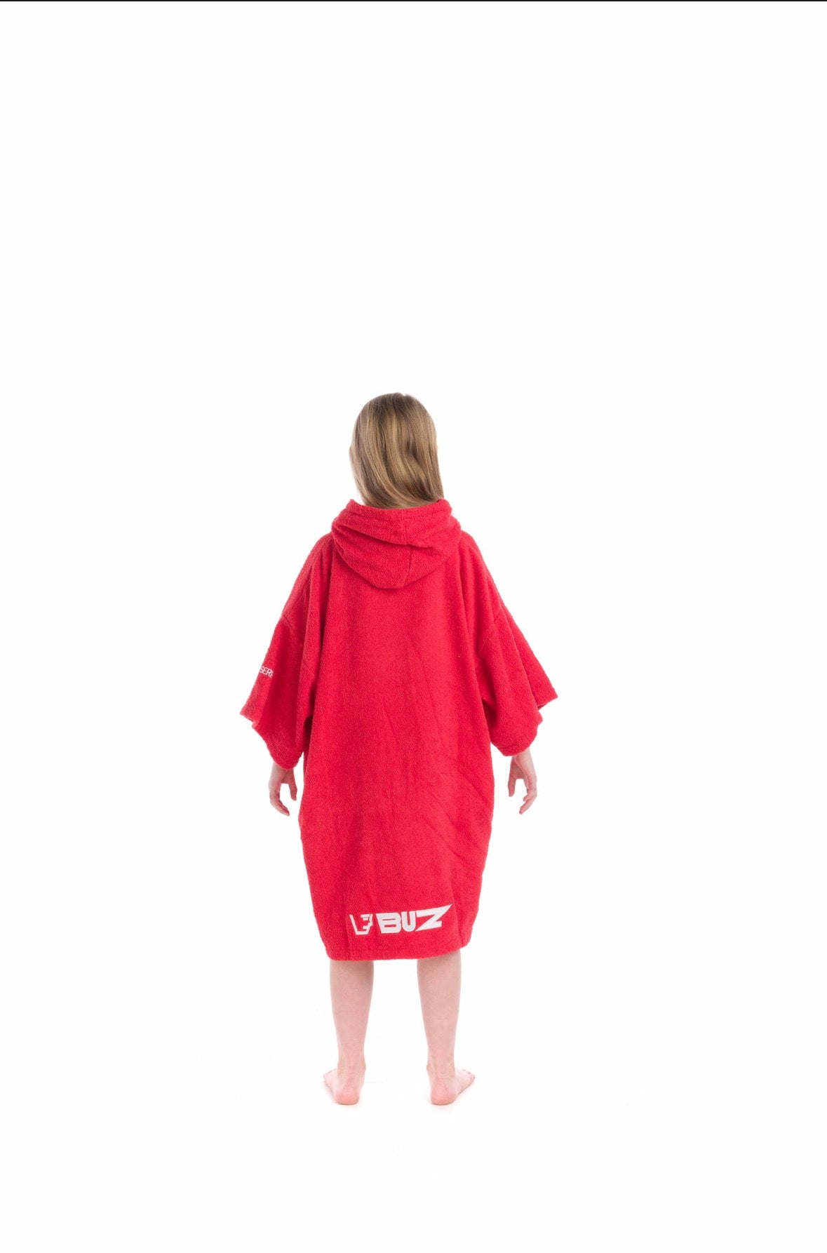 Person wearing a red hooded poncho with a embroidered Buz logo on a white background