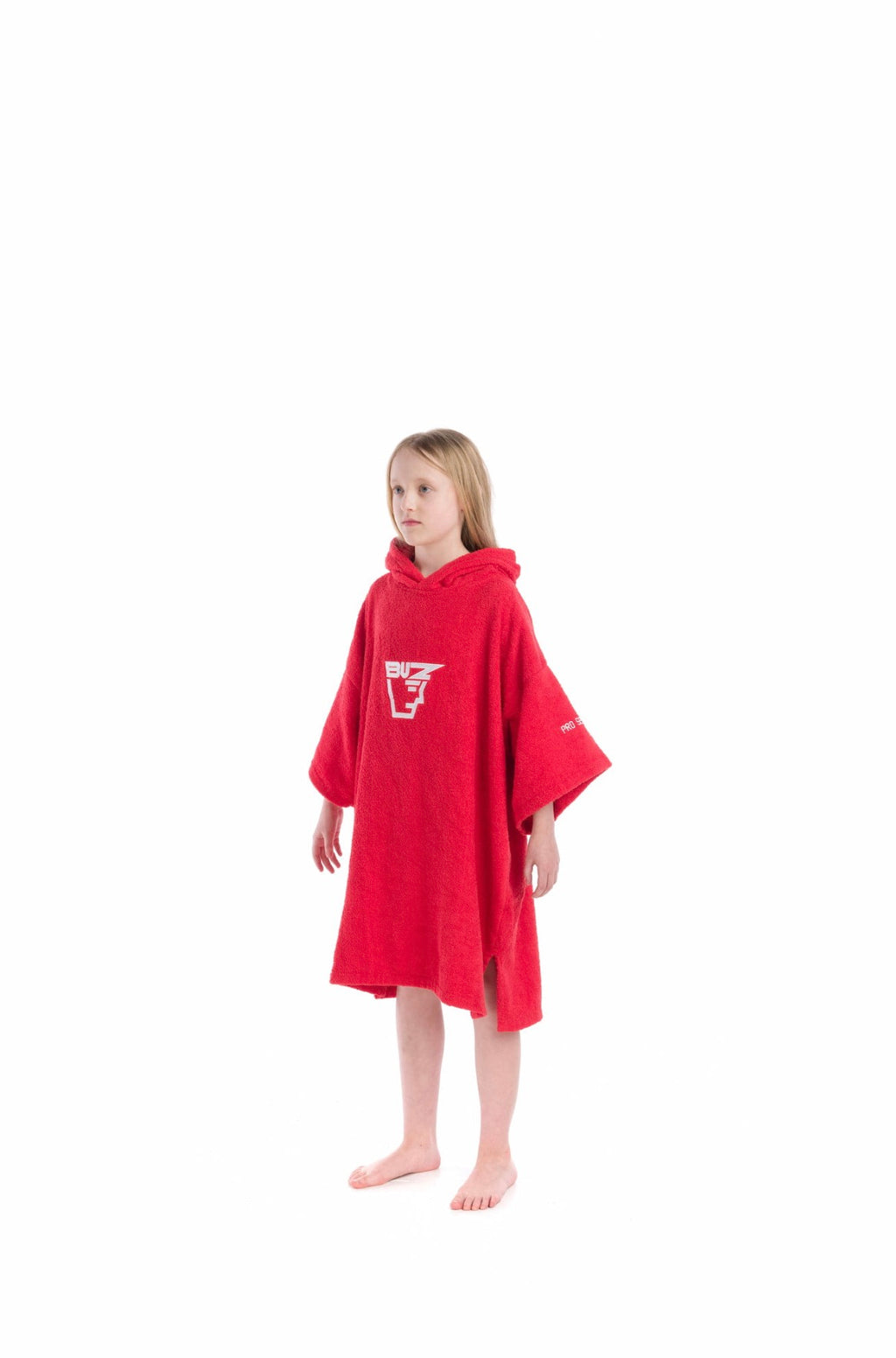 Child wearing a red hooded Buz poncho on a white background