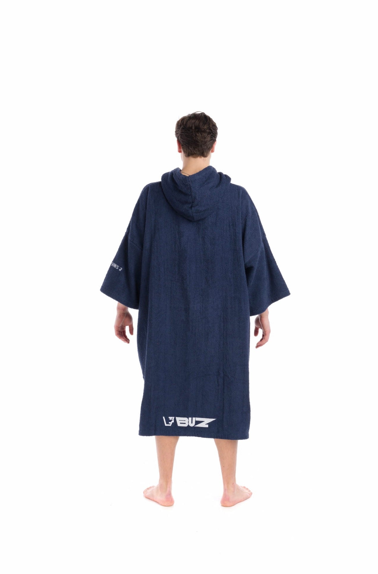 Person wearing a navy blue hooded towel with a brand logo on a white background
