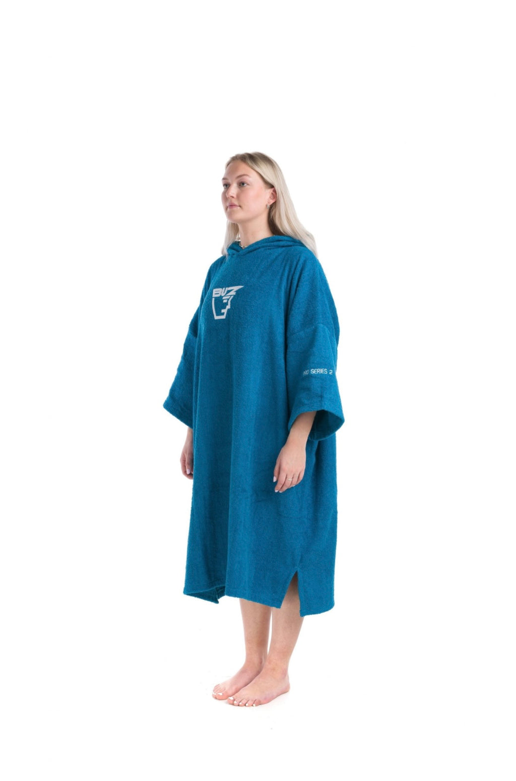Person wearing a blue changing poncho with a Buz logo on a white background