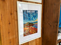 Framed poster of 'Rame Head' on a wooden wall
