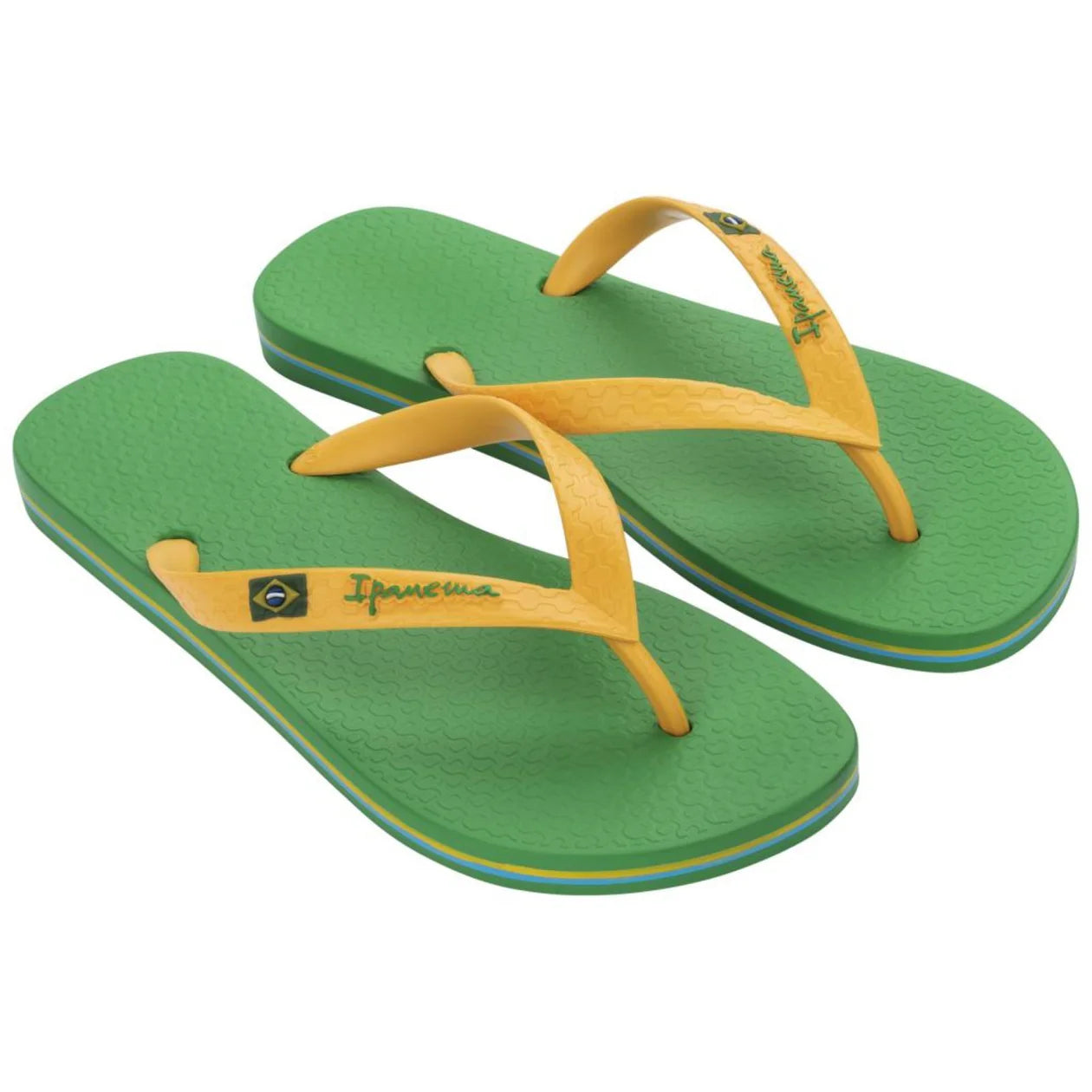 Green and yellow flip-flops with an ipanema logo on a white background
