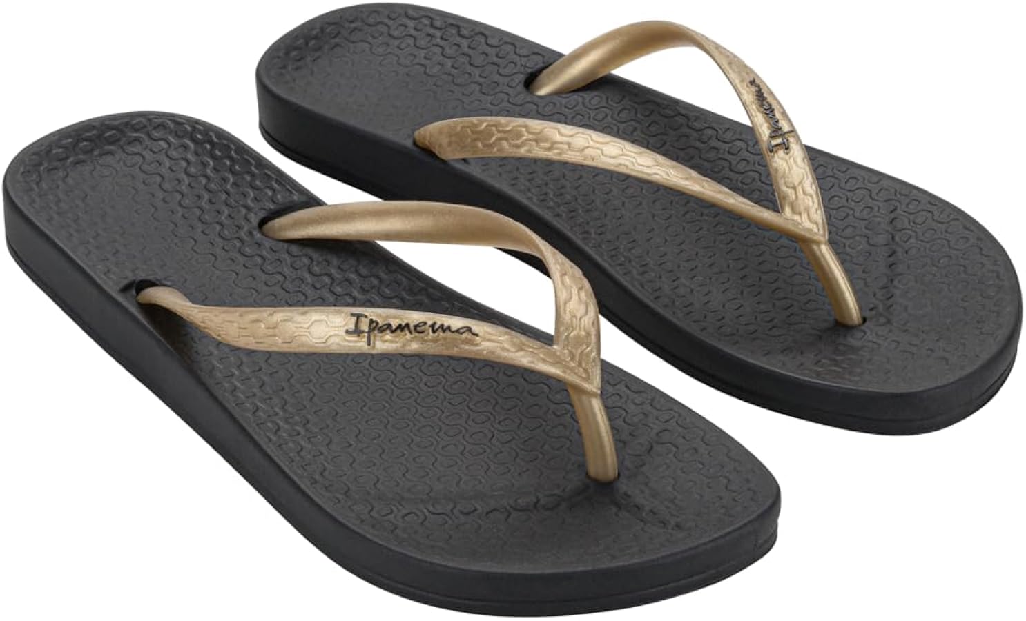 Black and gold flip-flops with 'Ipanema' branding on a white background