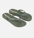 Pair of green flip-flops with glittery strap on a white background