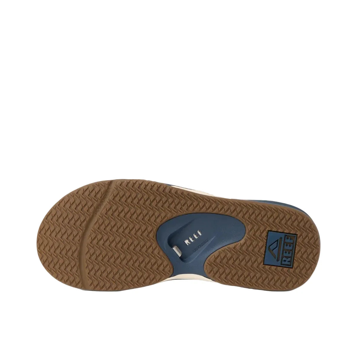 Close-up of a sandal sole with brown rubber and blue insole on a white background