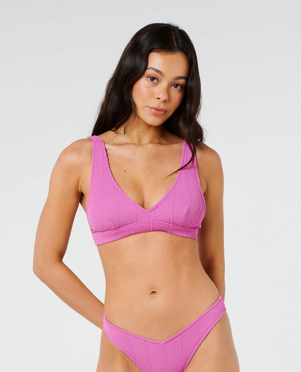 Woman wearing a pink Ripcurl bikini v neck