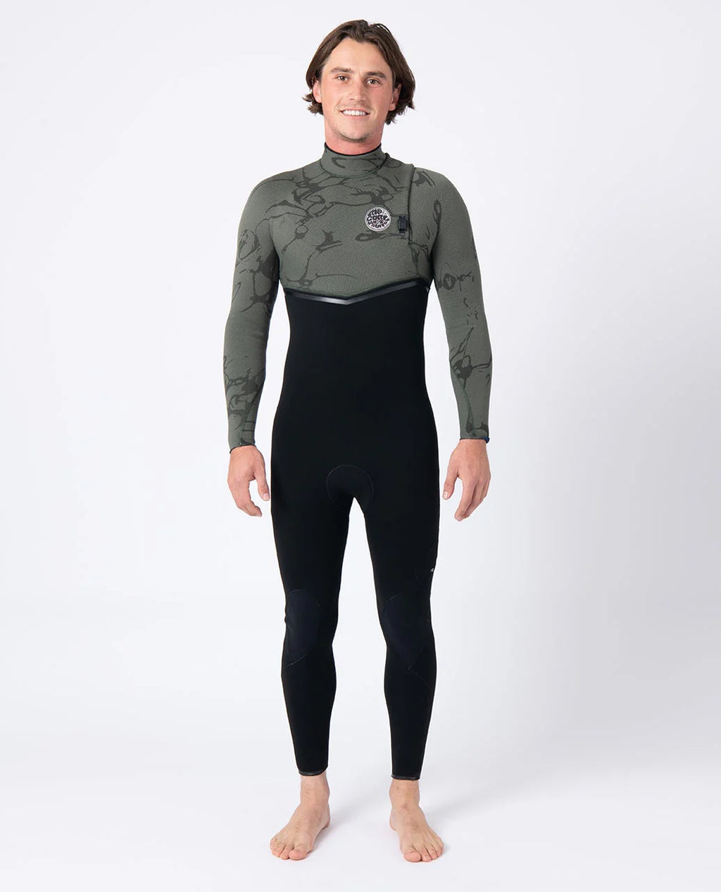 Person wearing a green and black Ripcurl zipperless wetsuit on a white background
