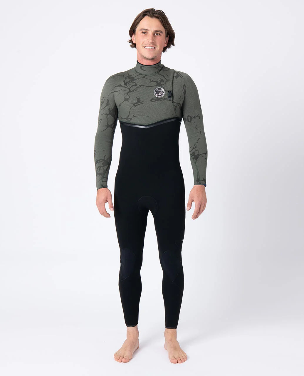 Person wearing a green and black Ripcurl zipperless wetsuit on a white background