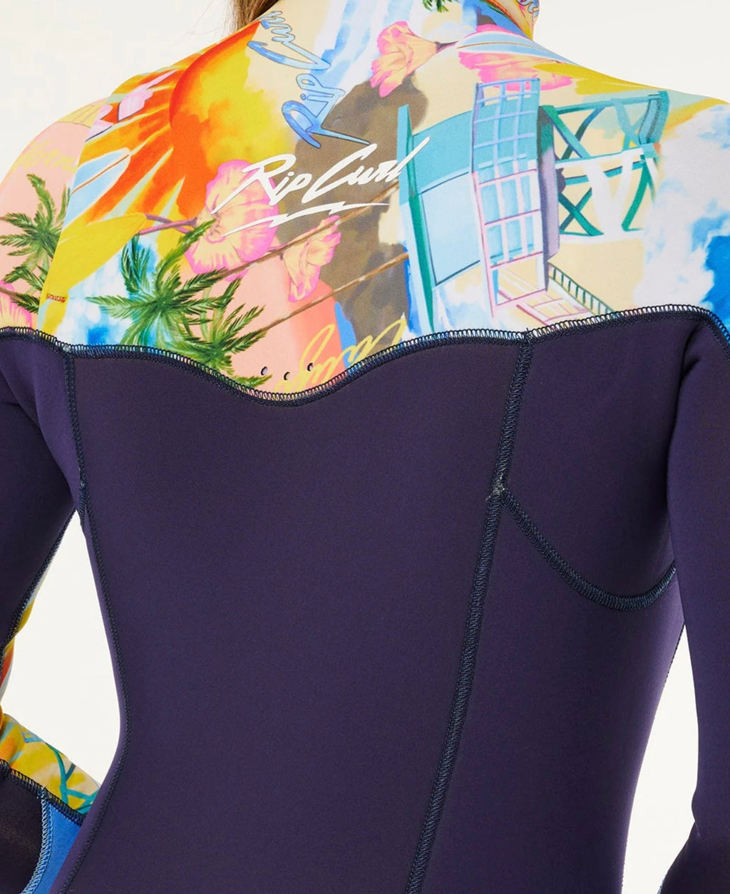 Close-up of a wetsuit with a colorful patterned back panel featuring the Rip Curl brand.