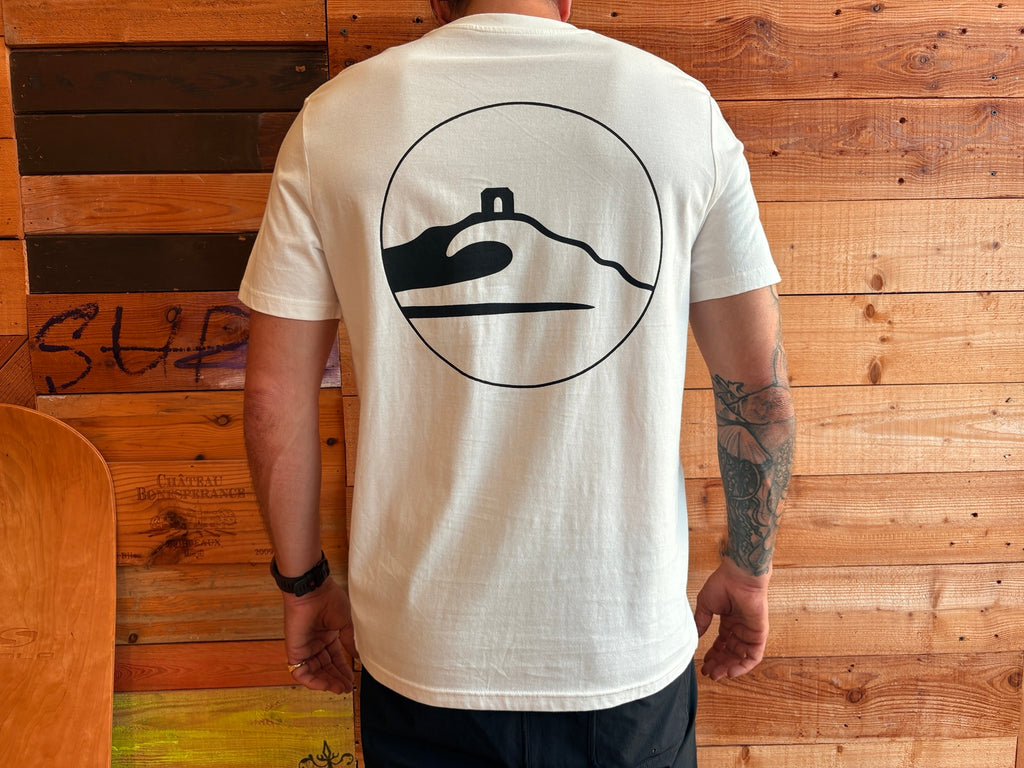 Adventure Bay Surf Shop round logo tee in bone back view worn by male model