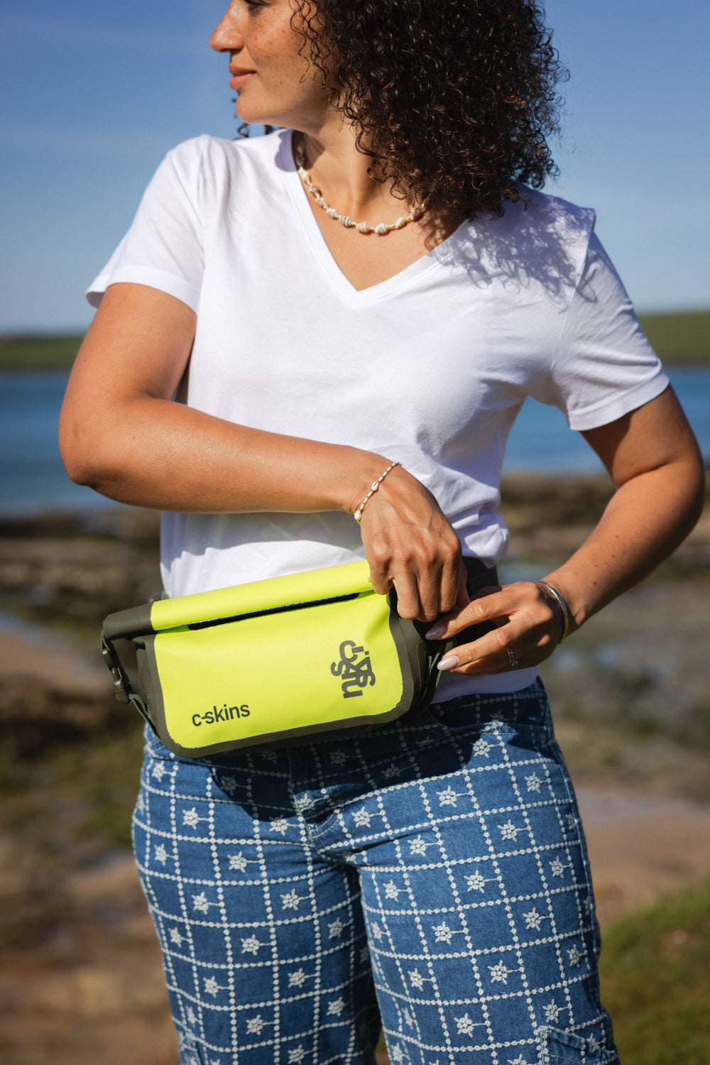 C-Skins Session 2L dry bag waist pack worn around the waist
