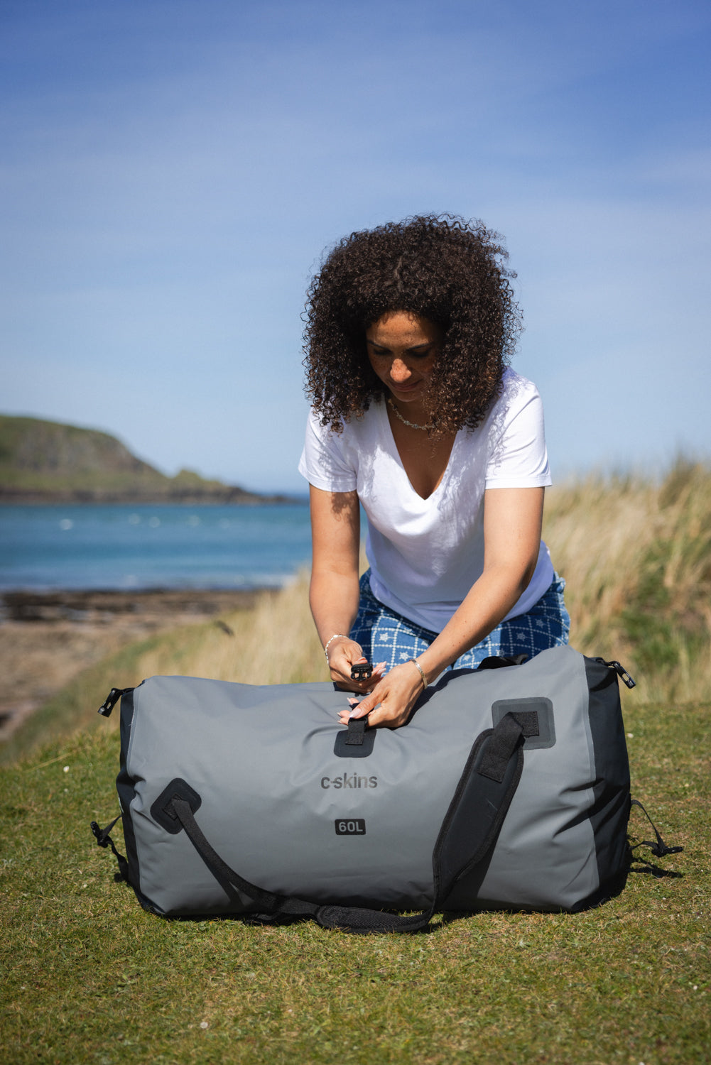 C-Skins Storm Chaser 60L dry duffel carry configuration in Storm Grey