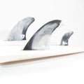 FCS II MR Twin + 1 Performance Core XL fins in black and white