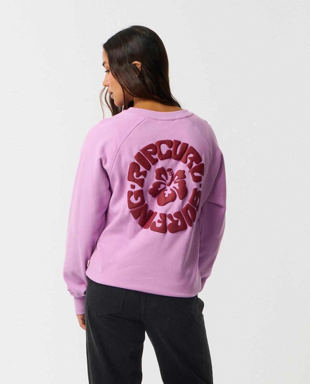 Ripcurl Women’s Surf Puff Raglan Relaxed Crew in bright lilac, back view