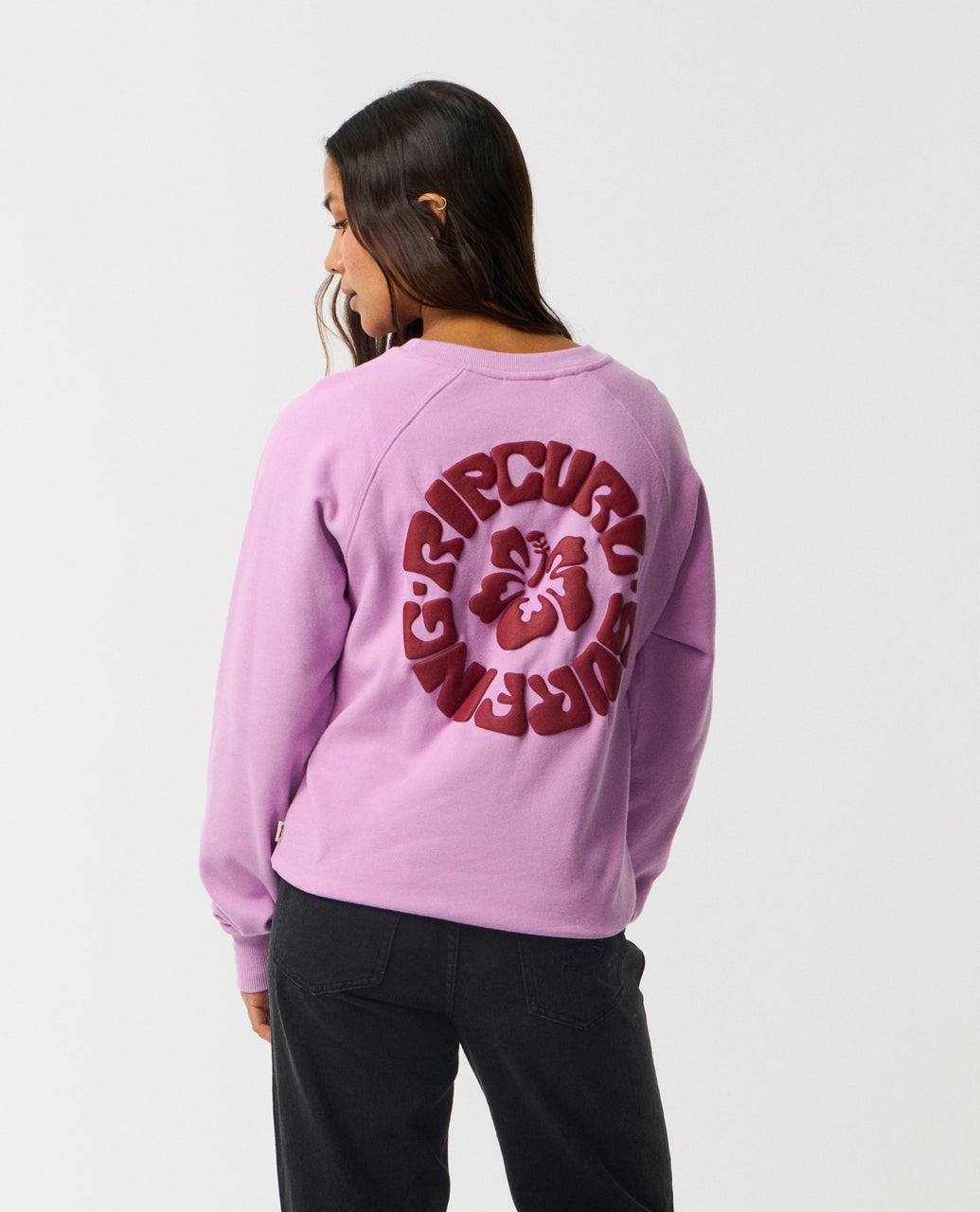 Ripcurl Women’s Surf Puff Raglan Relaxed Crew in bright lilac, back view