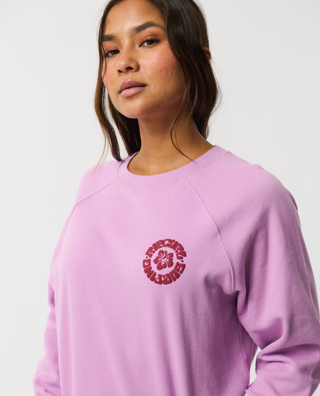 Ripcurl Women’s Surf Puff Raglan Relaxed Crew in bright lilac, front detail
