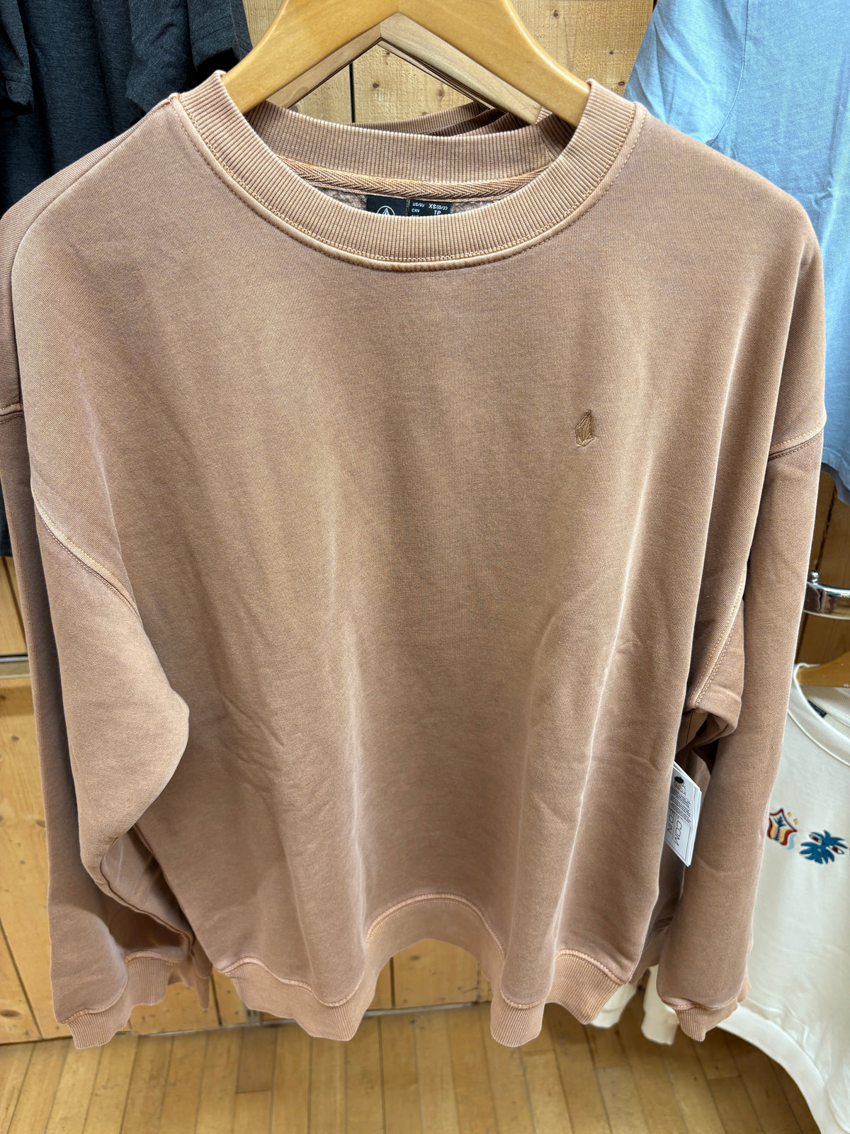 Volcom Women’s Stone Soft Crew in Pale Khaki, front view on hanger